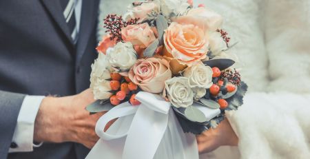 Bride and Groom holding flowers